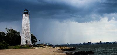 Lighthouse with a rainstorm in the background